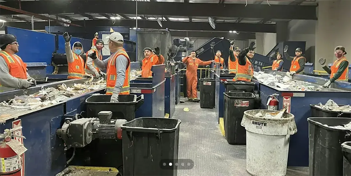 Workers waving on the recycling line at Marin Sanitary Service