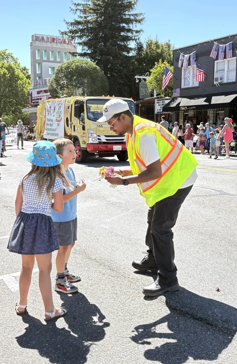 MSS Driver leans down to talk to 2 kids at the Fairfax Festival 2026