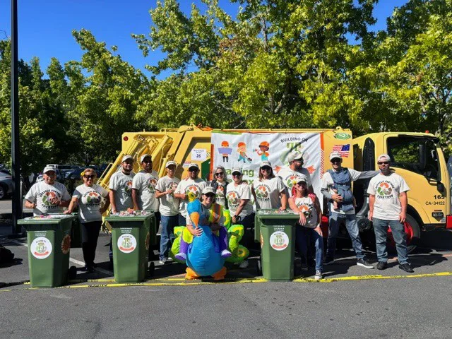 The MSS parade team poses in front of a garbage truck at the Fairfax Festival 2026
