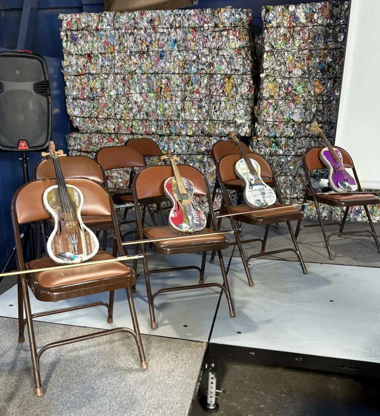 The Recycled Orchestra instruments on chairs.